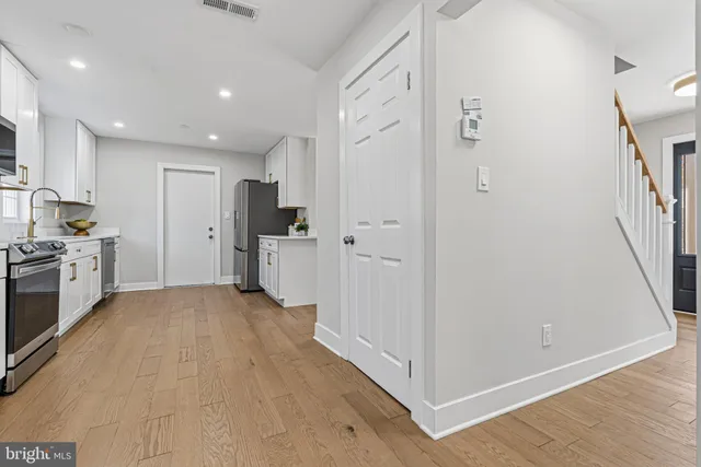 a kitchen with a sink and a window