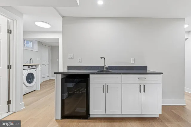 a view of a brick house with a small yard