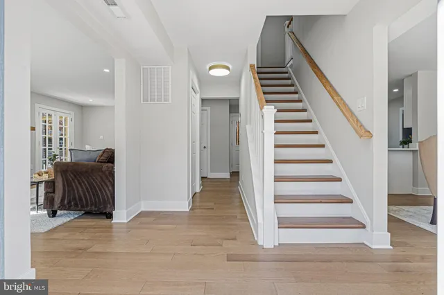 a living room with fireplace furniture and a window