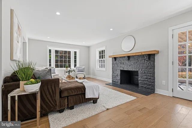 a view of a porch with wooden floor and fence