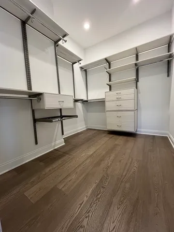 a view of a brick house with many windows