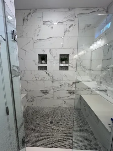 a view of a house with a yard next to a lake