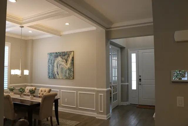 a large kitchen with a table and chairs
