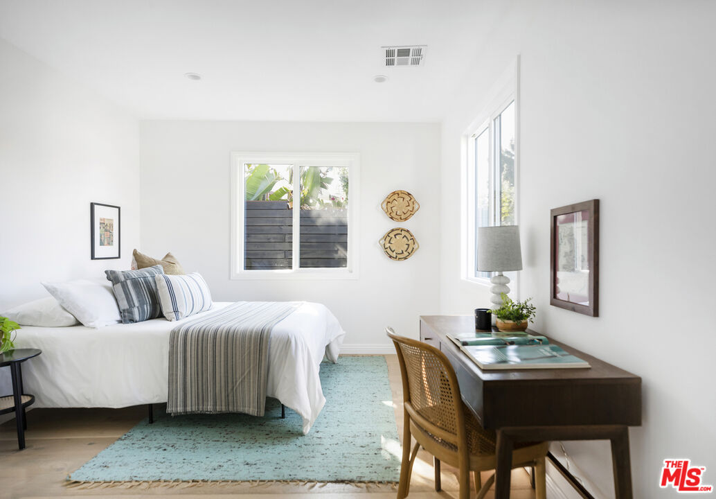 479 Crane Boulevard Los Angeles, CA 90065 - Photo 13 of 35 a bedroom with a bed and a table in it