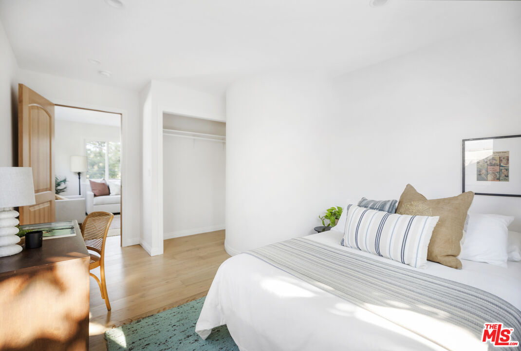 479 Crane Boulevard Los Angeles, CA 90065 - Photo 14 of 35 a spacious bedroom with a bed and wooden floor