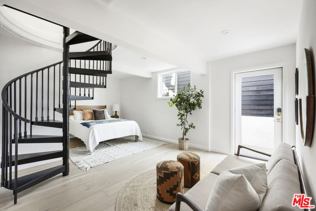 479 Crane Boulevard Los Angeles, CA 90065 - Photo 16 of 35 a bedroom with furniture and a window