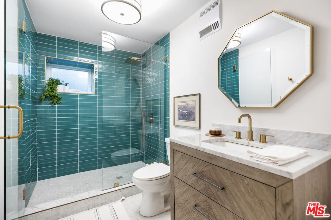 479 Crane Boulevard Los Angeles, CA 90065 - Photo 19 of 35 a bathroom with a shower sink vanity mirror and toilet