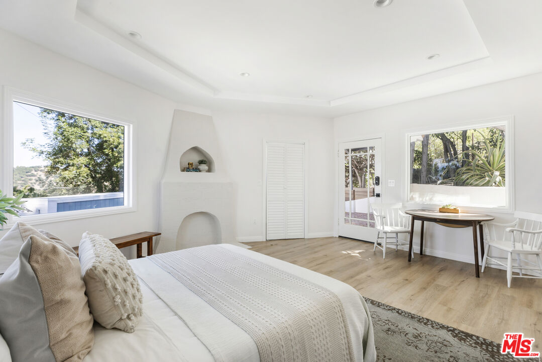 479 Crane Boulevard Los Angeles, CA 90065 - Photo 24 of 35 a bedroom with a bed and a window