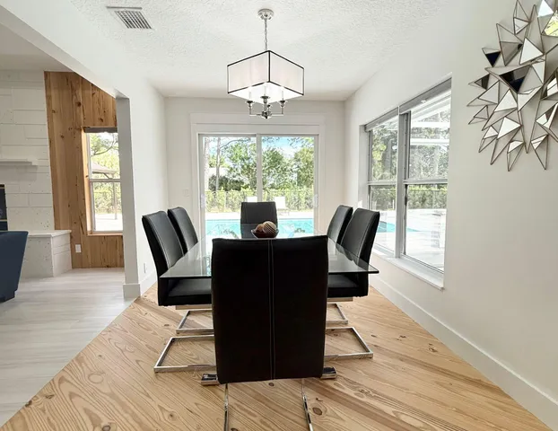 a view of a dining room with furniture window and outside view