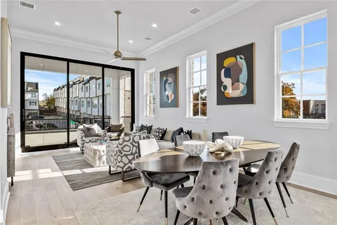 a view of a dining room with furniture window and outside view