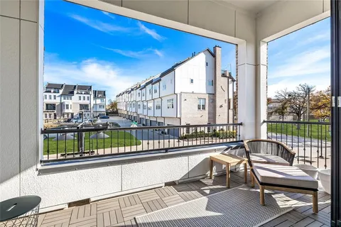 a view of a balcony with wooden floor