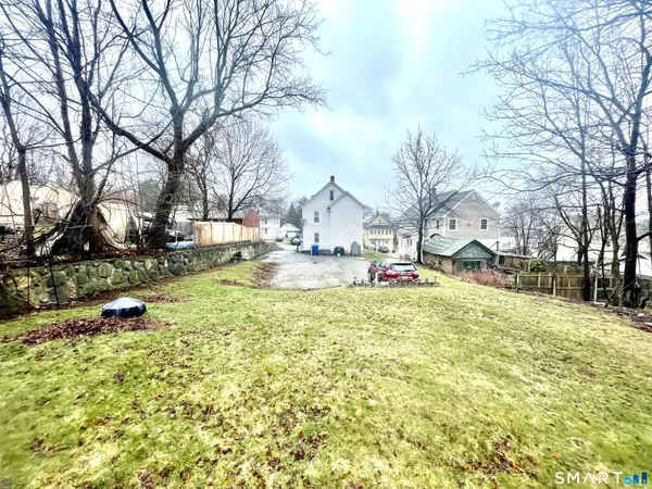 a view of the house with a yard