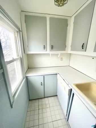 a view of a kitchen with storage and utility