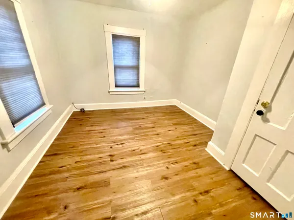a view of an empty room with a fireplace