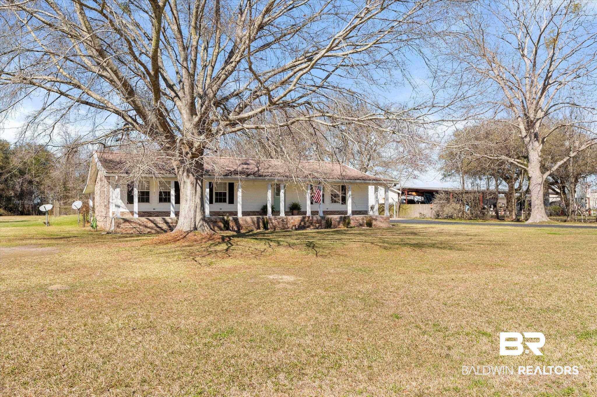 14280 Cat Deakle Road Grand Bay, AL 36541 - Photo 39 of 51 View of front of property with a porch, a front lawn, and an attached carport