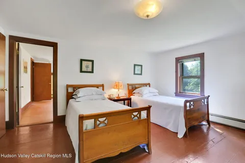 a bed room with a bed and a window