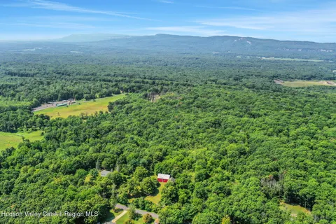 a view of a big yard with lots of green space