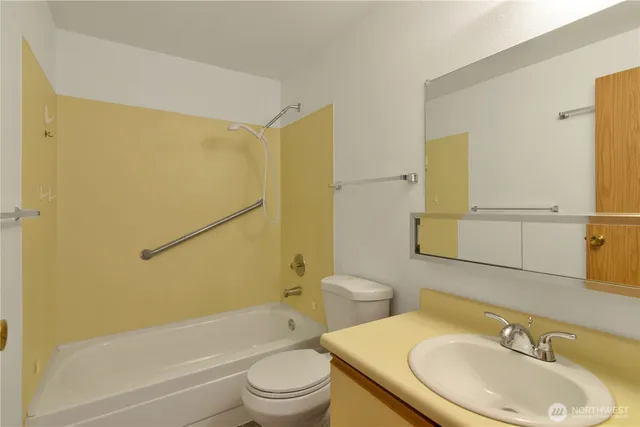 a view of a hallway with a room