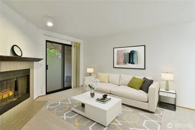 a living room with furniture a fireplace with wooden floor