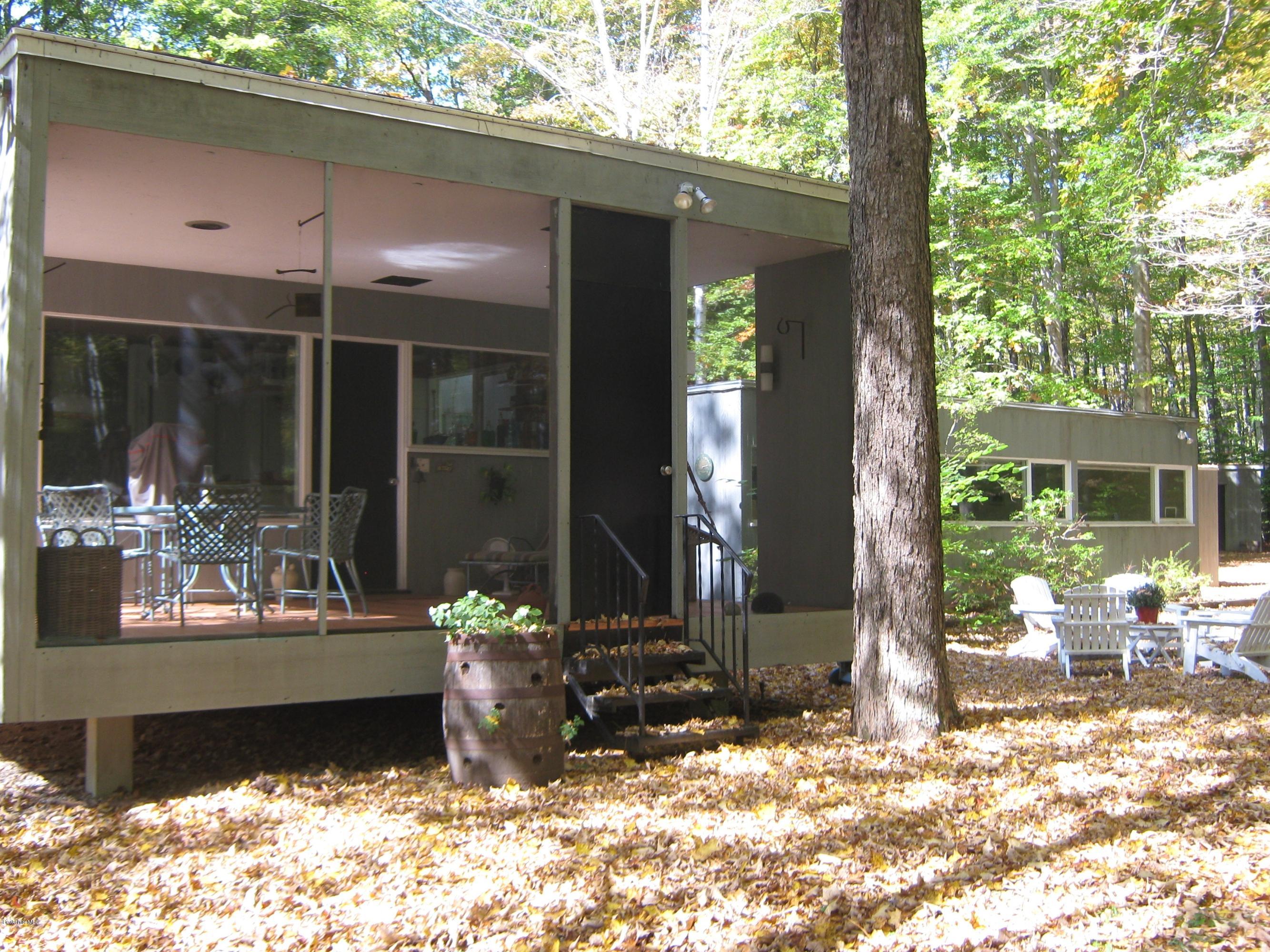 231 Summit Road Richmond, MA 01254 - Photo 2 of 69 a front view of a house with a patio