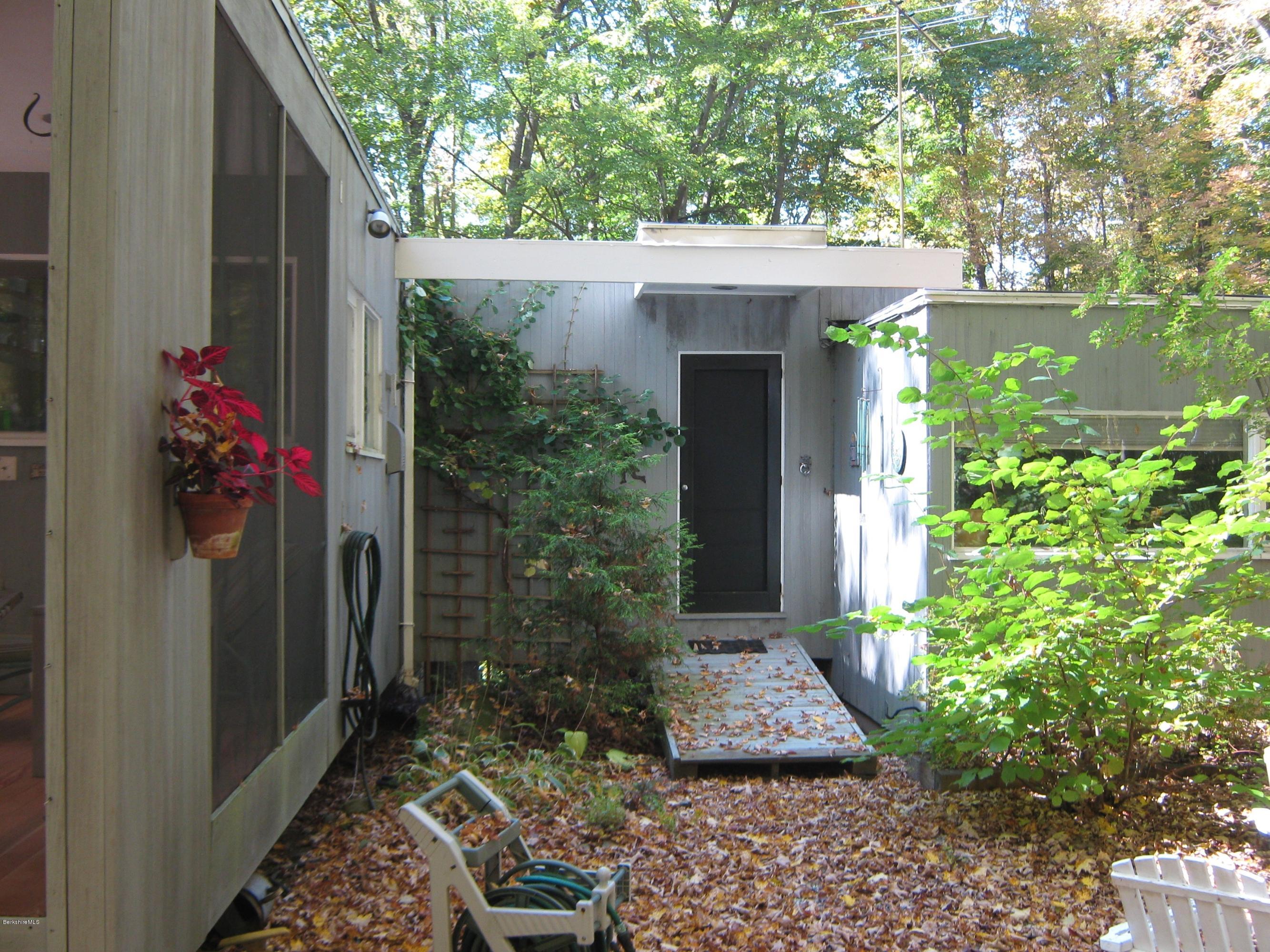 231 Summit Road Richmond, MA 01254 - Photo 19 of 69 a view of a house with a flower garden
