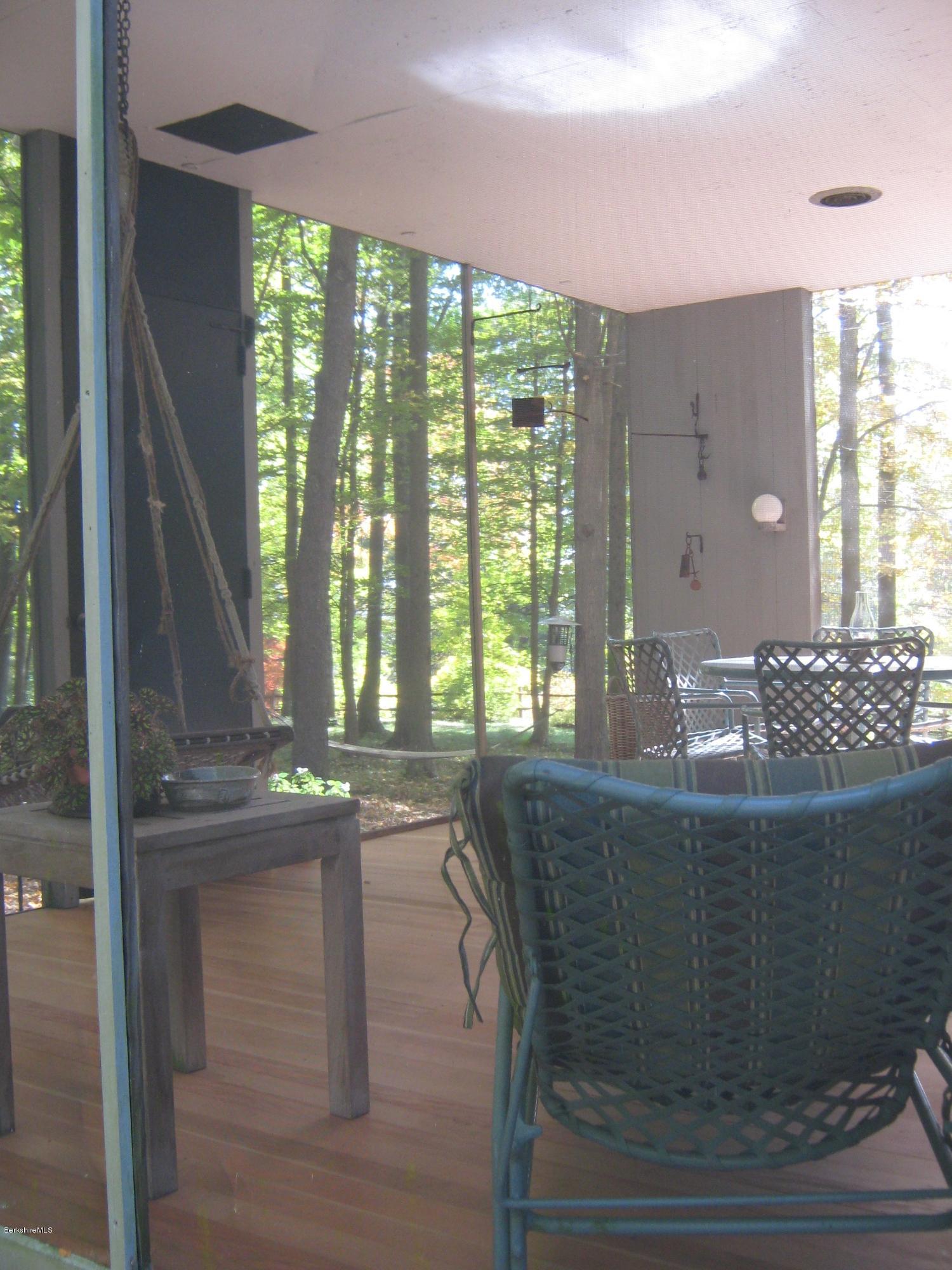 231 Summit Road Richmond, MA 01254 - Photo 24 of 69 a dining table with chairs and wooden floor