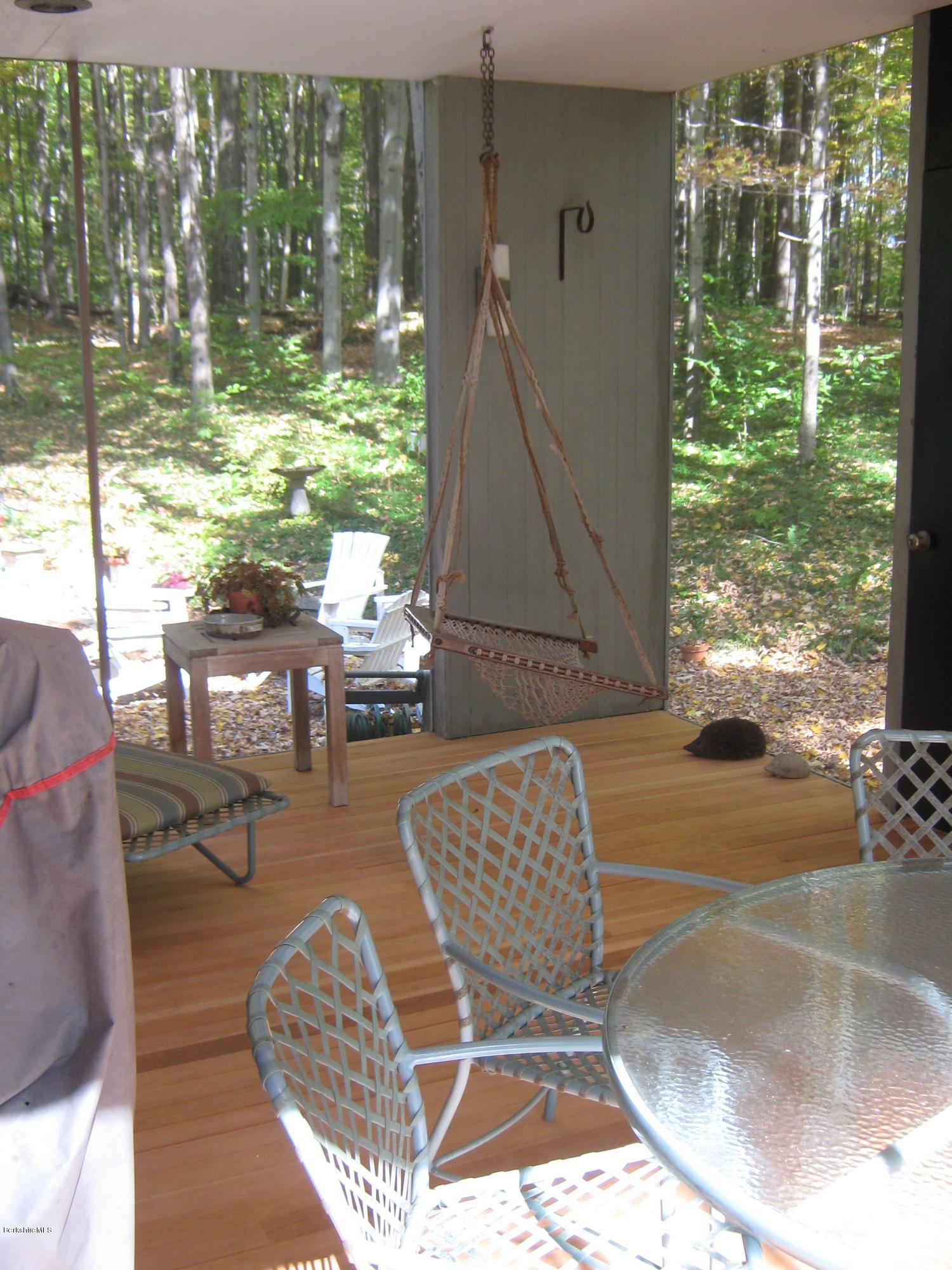 231 Summit Road Richmond, MA 01254 - Photo 25 of 69 a living room with large trees and a floor to ceiling window