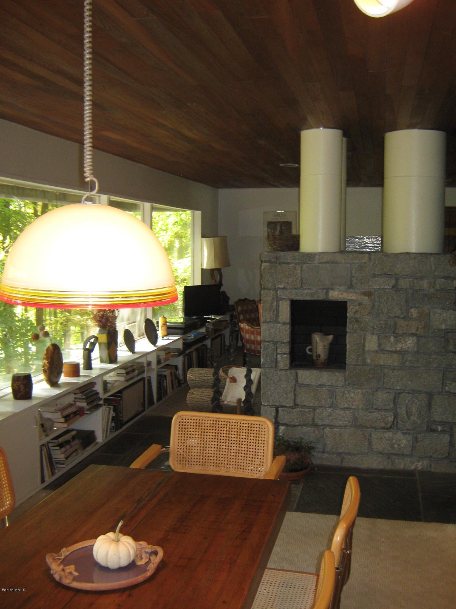 231 Summit Road Richmond, MA 01254 - Photo 29 of 69 a living room with furniture and a fireplace
