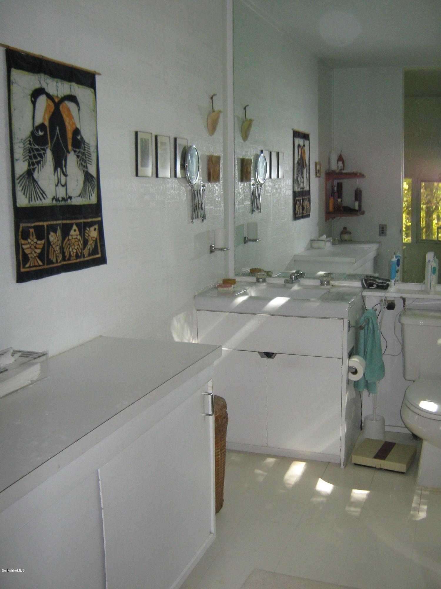 231 Summit Road Richmond, MA 01254 - Photo 41 of 69 a bathroom with a sink a vanity and a mirror