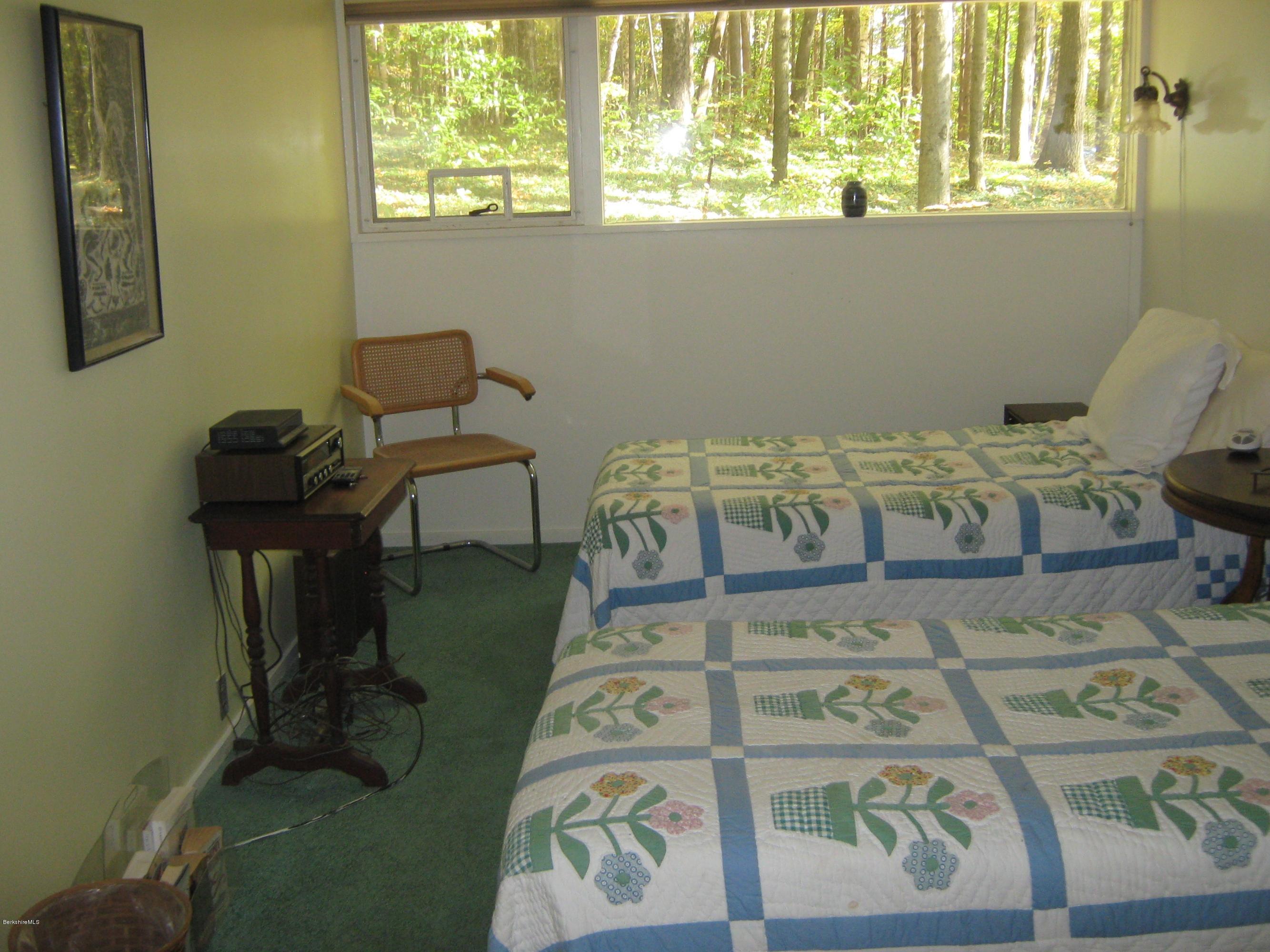 231 Summit Road Richmond, MA 01254 - Photo 52 of 69 a bedroom with a bed and a chair
