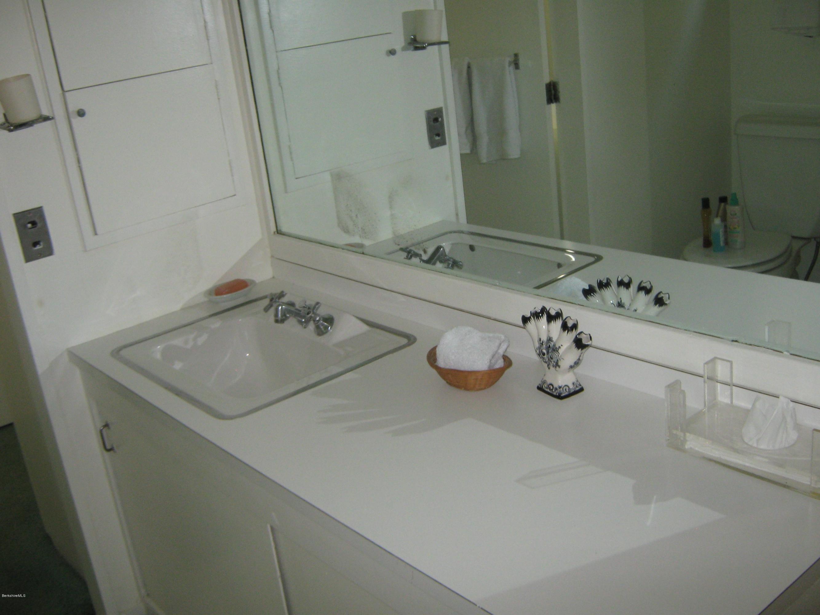 231 Summit Road Richmond, MA 01254 - Photo 61 of 69 a bathroom with a sink and a mirror