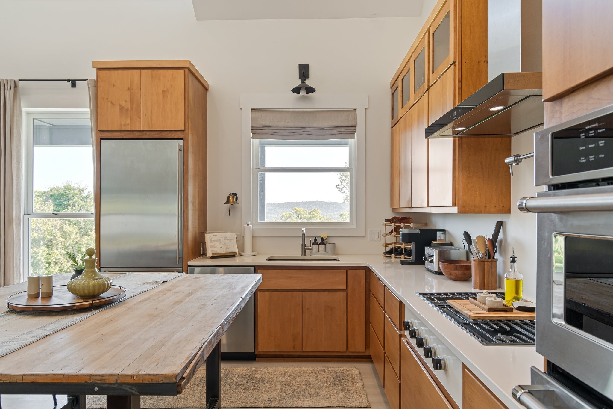 8740 Howell Road Mount Pleasant, TN 38474 - Photo 22 of 70 a kitchen with a stove a sink and a refrigerator