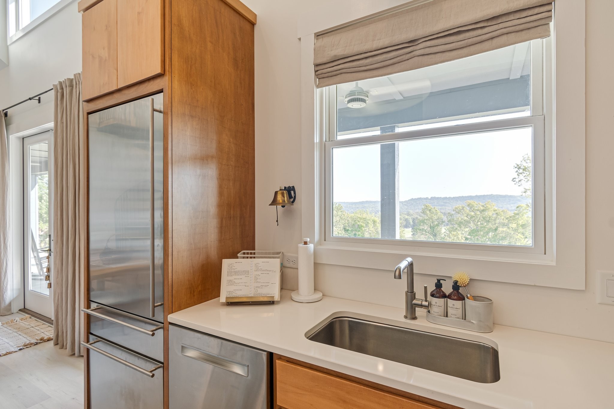 8740 Howell Road Mount Pleasant, TN 38474 - Photo 24 of 70 a bathroom with a sink and a large mirror