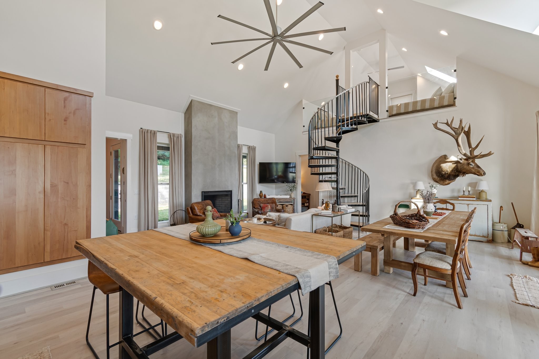 8740 Howell Road Mount Pleasant, TN 38474 - Photo 25 of 70 a view of a dining room with furniture and chandelier