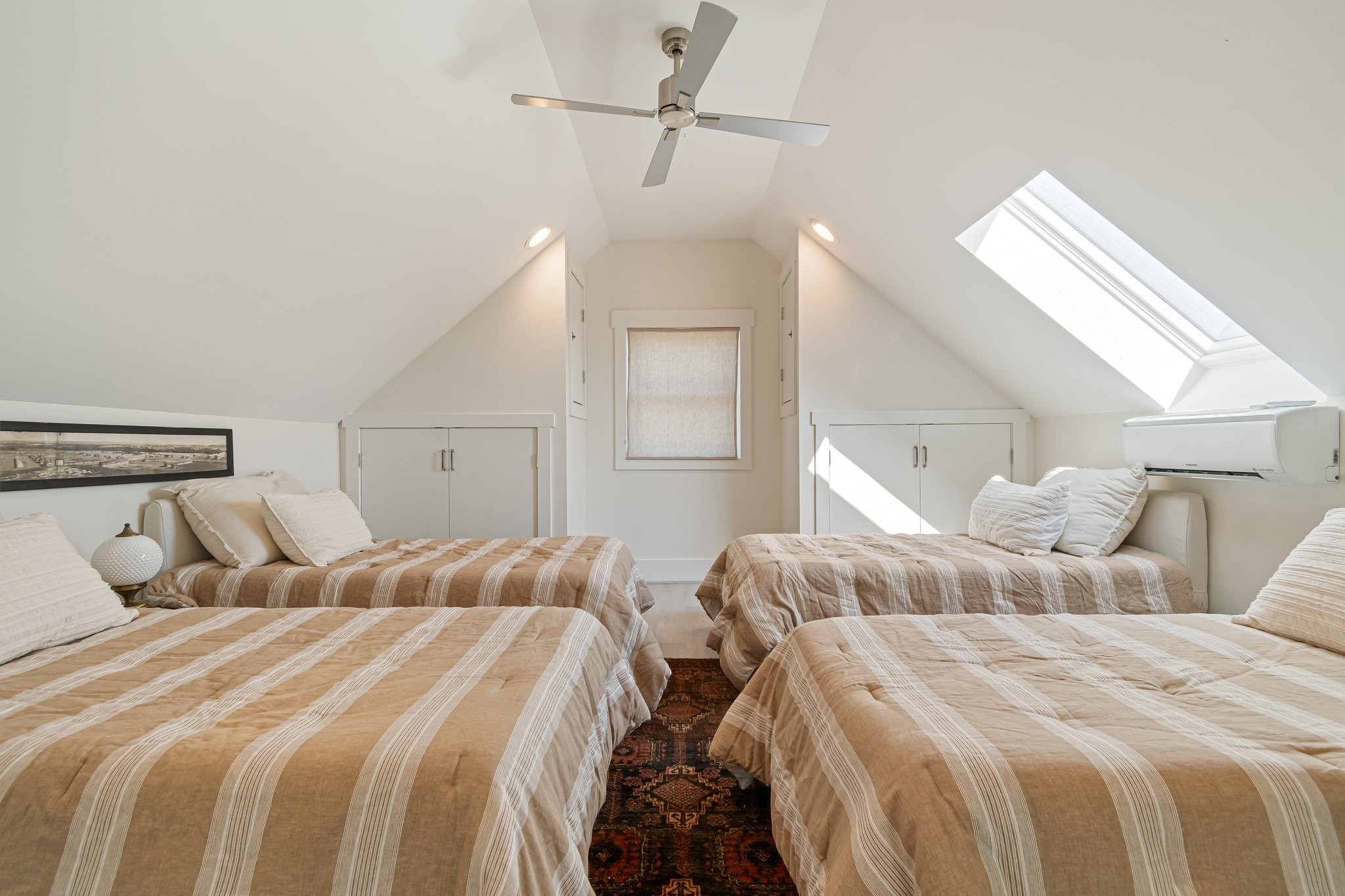 8740 Howell Road Mount Pleasant, TN 38474 - Photo 32 of 70 a bedroom with two beds and a ceiling fan