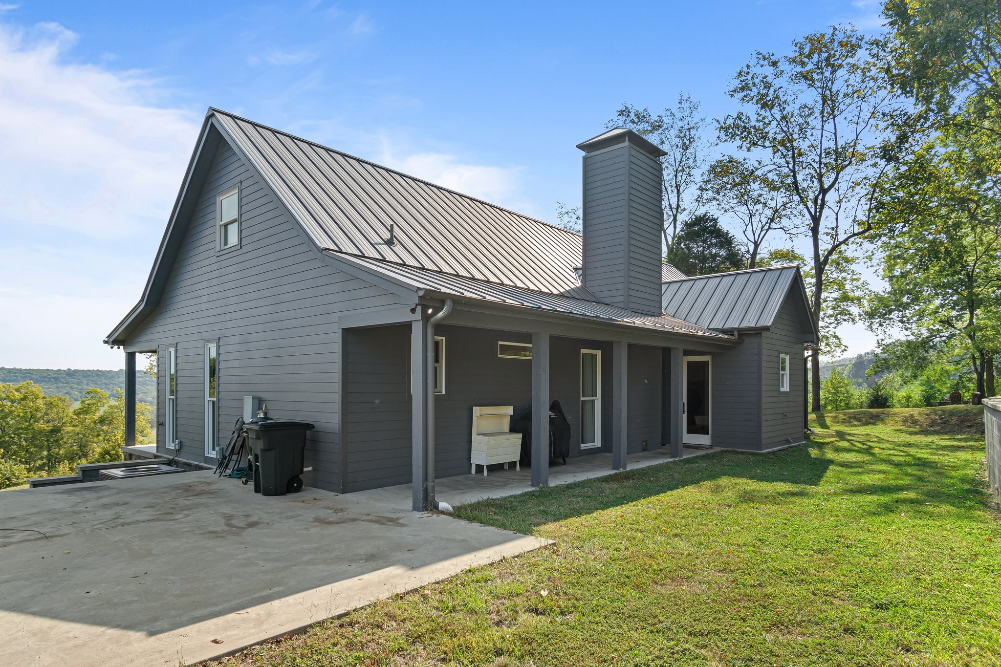 8740 Howell Road Mount Pleasant, TN 38474 - Photo 35 of 70 a front view of a house with garden