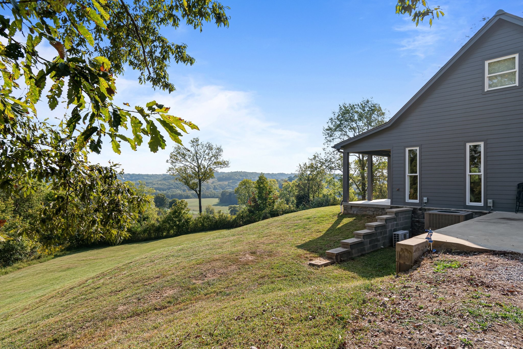 8740 Howell Road Mount Pleasant, TN 38474 - Photo 36 of 70 a view of a house with backyard and sitting area