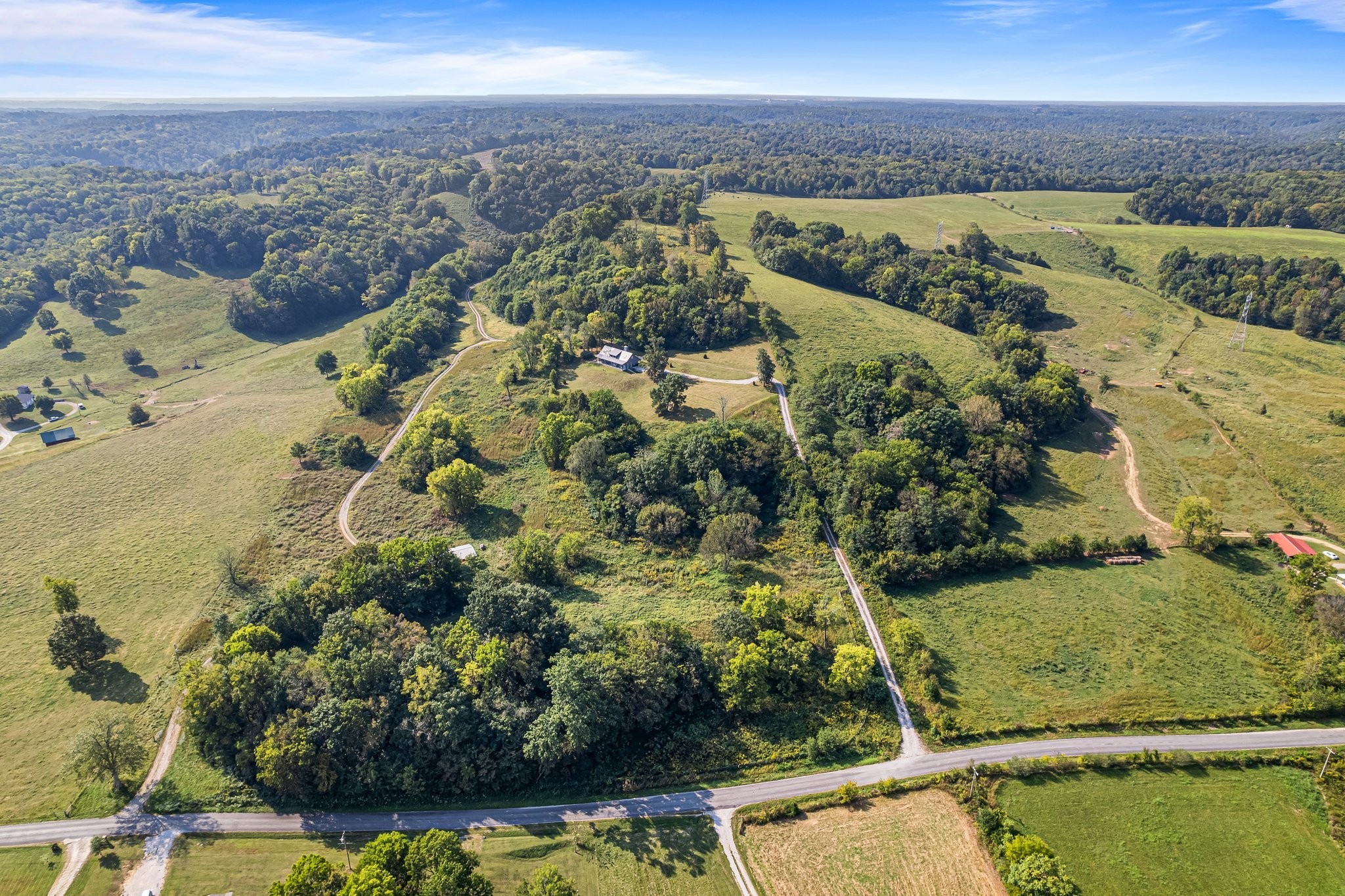8740 Howell Road Mount Pleasant, TN 38474 - Photo 41 of 70 a view of a lake with a mountain in the background