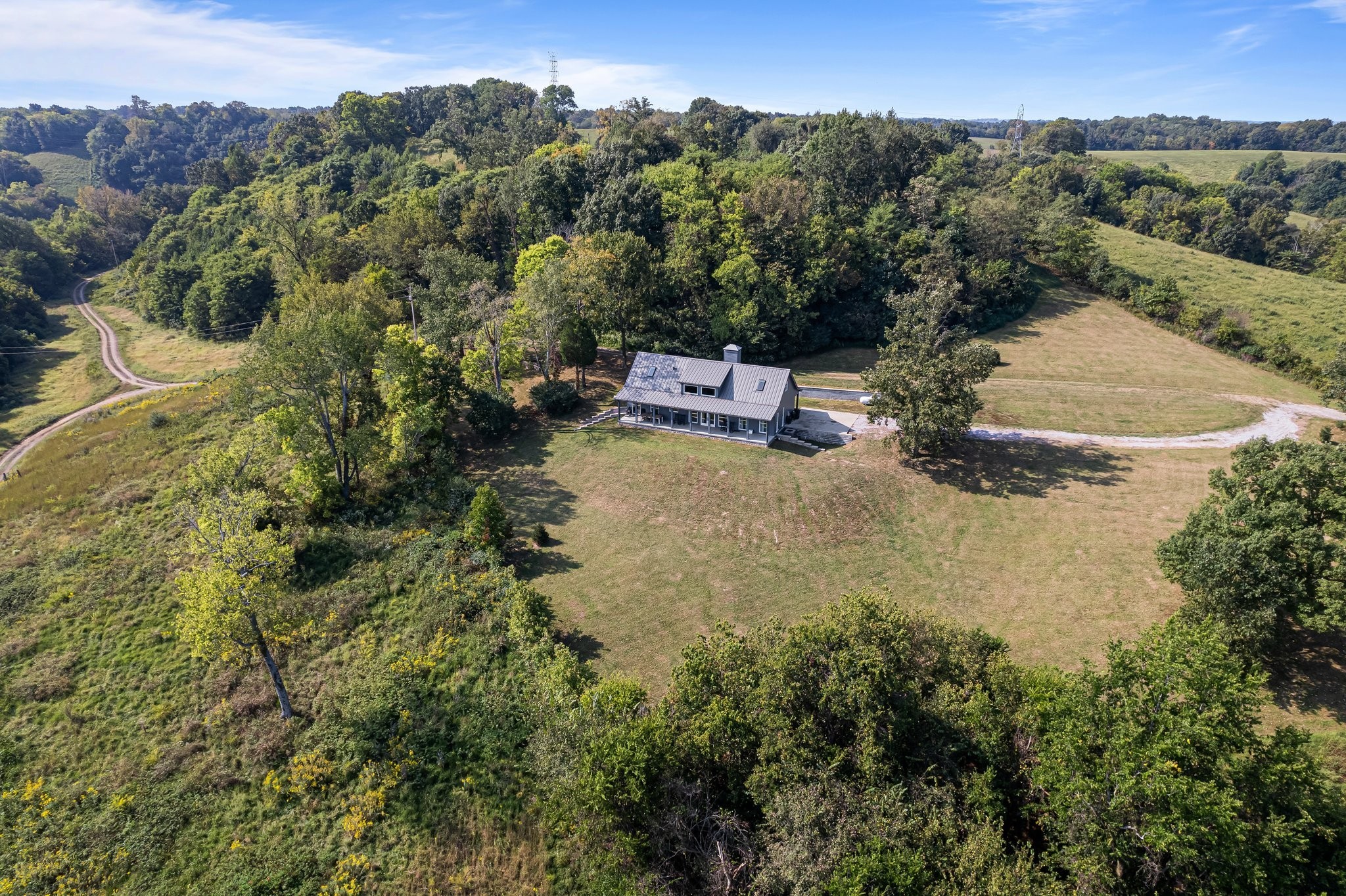 8740 Howell Road Mount Pleasant, TN 38474 - Photo 43 of 70 an aerial view of a house with a yard