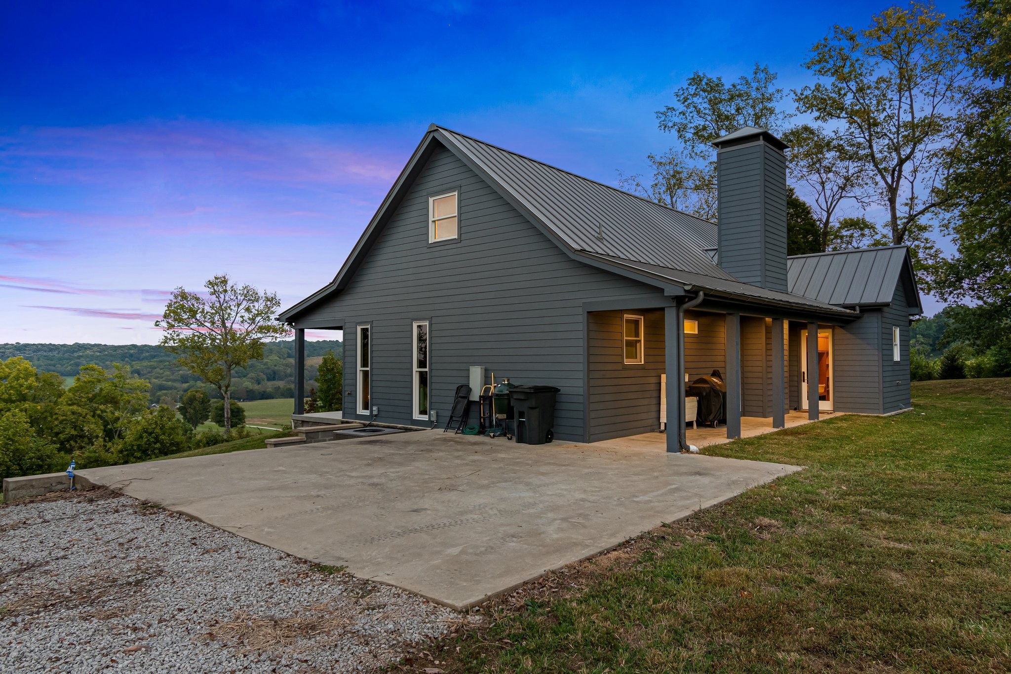 8740 Howell Road Mount Pleasant, TN 38474 - Photo 54 of 70 a front view of a house with a yard and garage