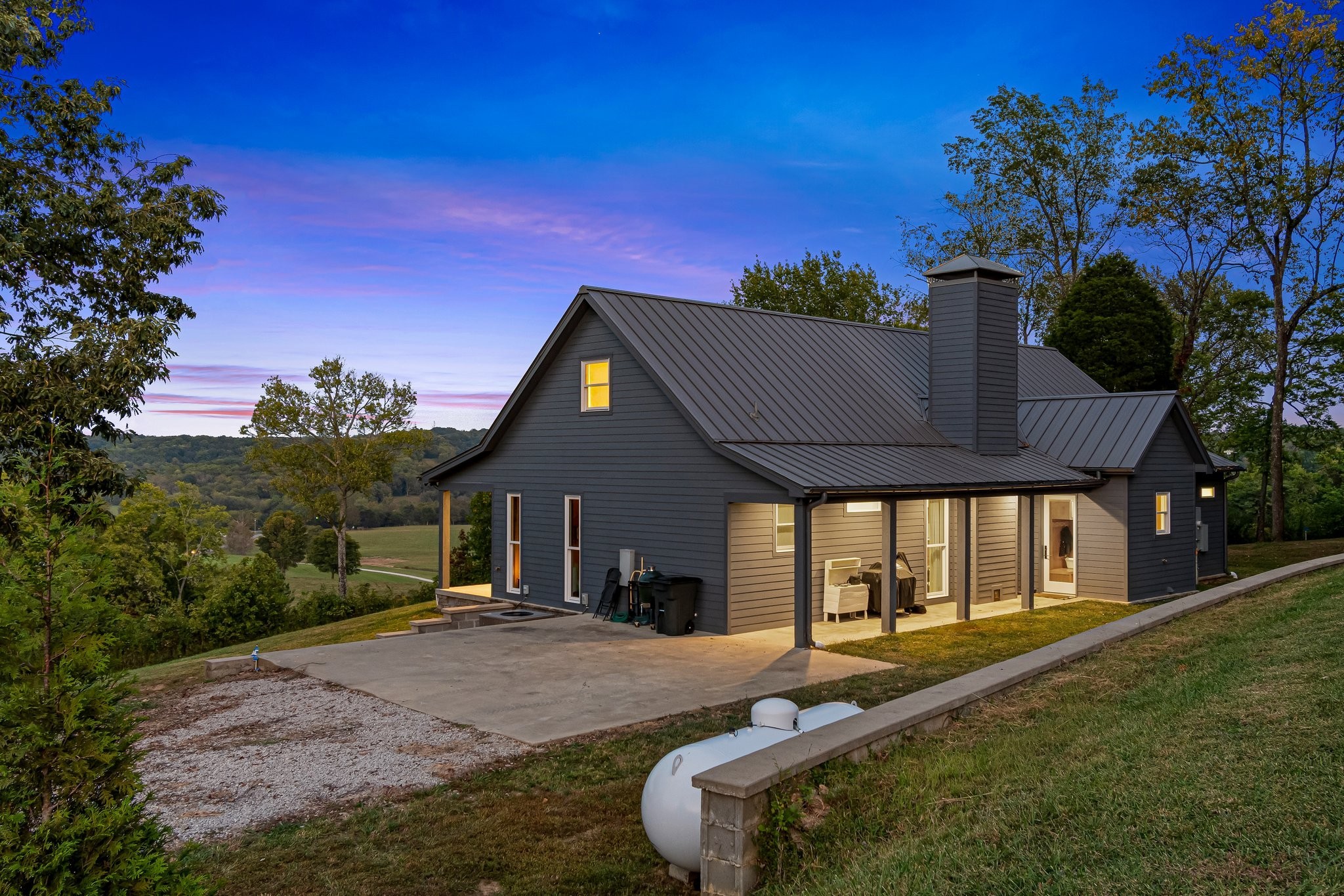 8740 Howell Road Mount Pleasant, TN 38474 - Photo 55 of 70 a front view of a house with garden