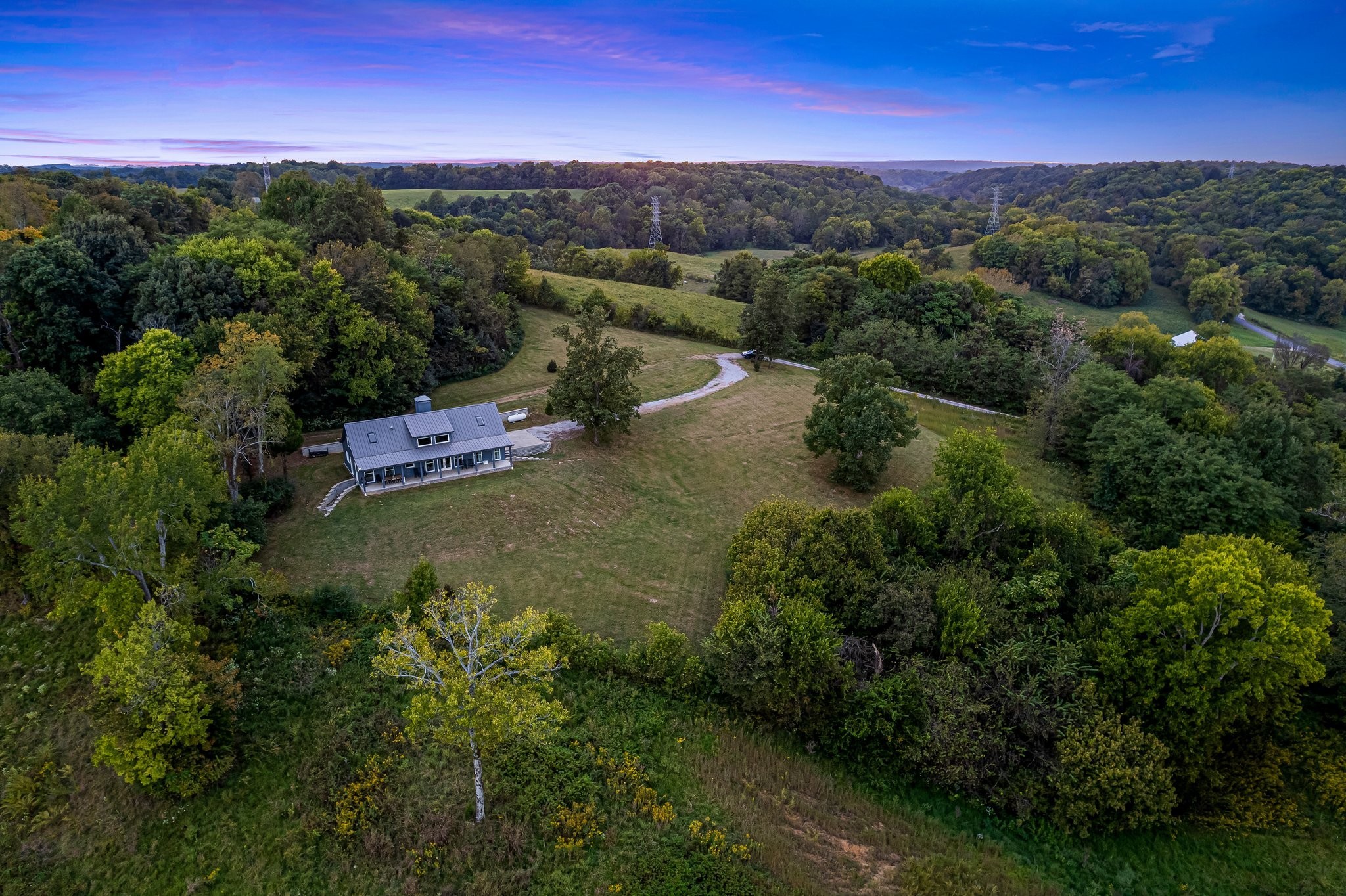 8740 Howell Road Mount Pleasant, TN 38474 - Photo 59 of 70 an aerial view of a houses with outdoor space and street view