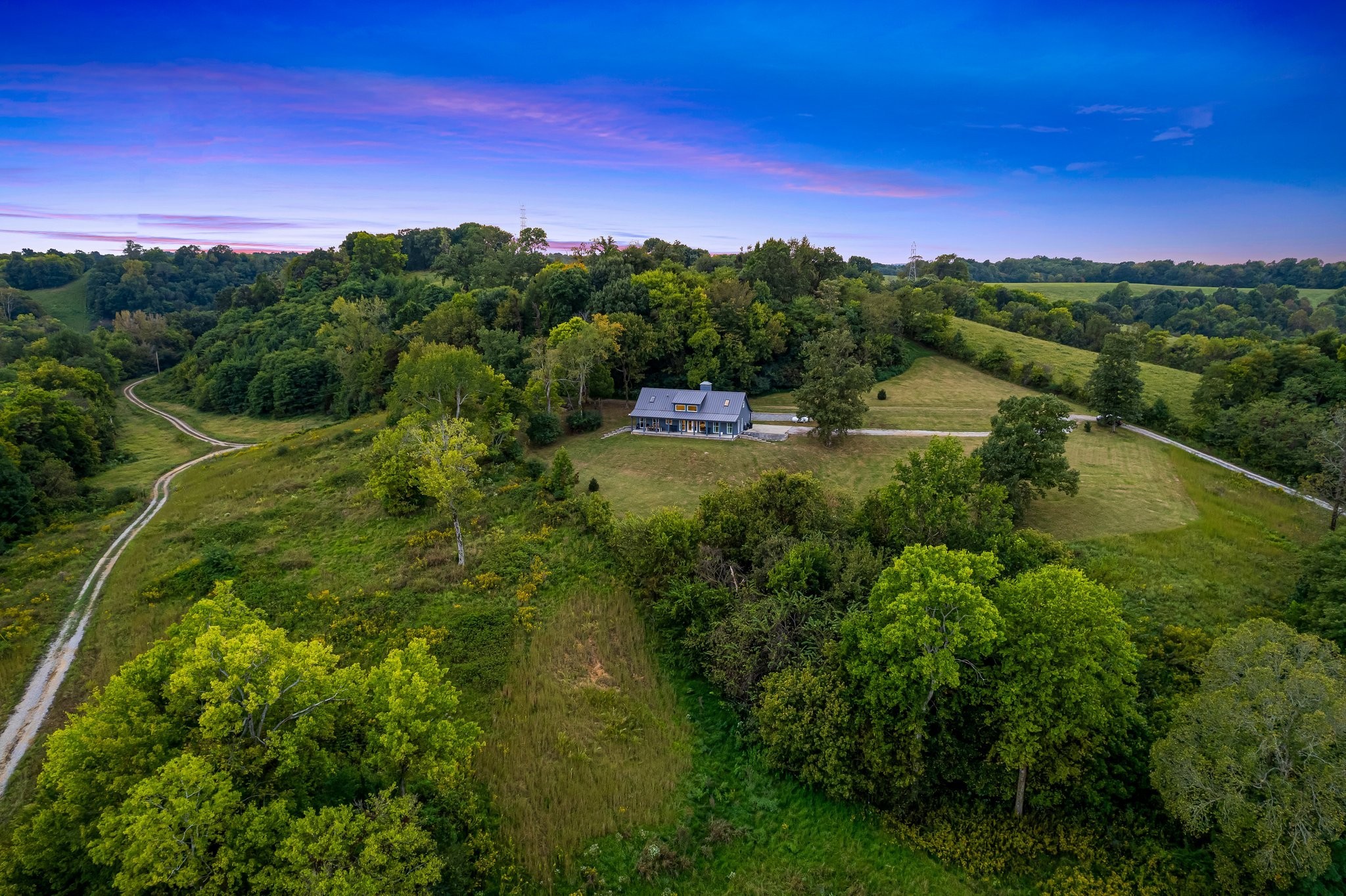 8740 Howell Road Mount Pleasant, TN 38474 - Photo 63 of 70 a view of a city with lush green forest