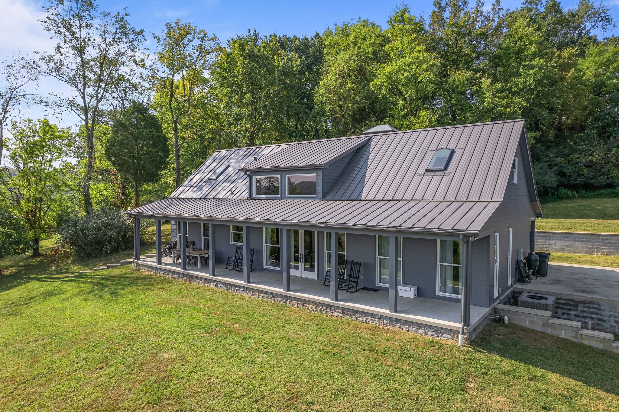 8740 Howell Road Mount Pleasant, TN 38474 - Photo 68 of 70 a view of a house with pool and chairs