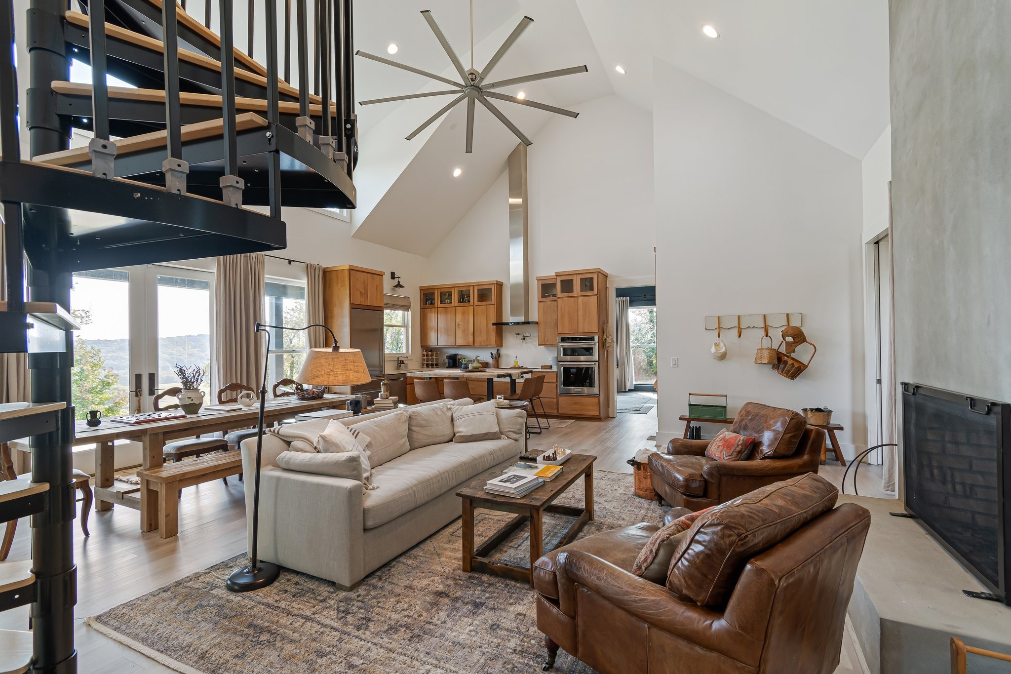 8740 Howell Road Mount Pleasant, TN 38474 - Photo 9 of 70 a living room with furniture a ceiling fan and a rug