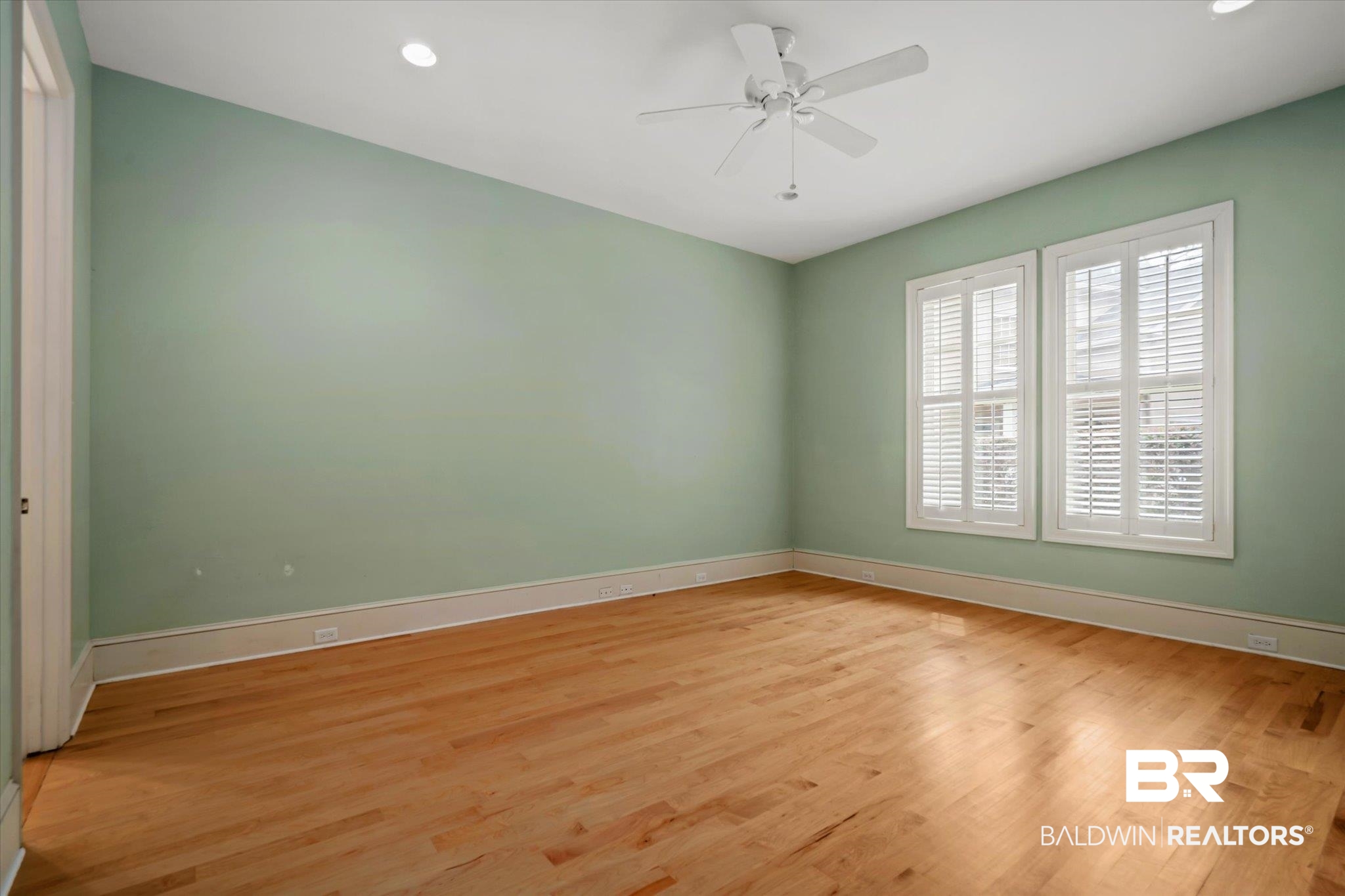 812 Country Club Court Mobile, AL 36609 - Photo 14 of 34 Empty room featuring light hardwood / wood-style flooring and ceiling fan