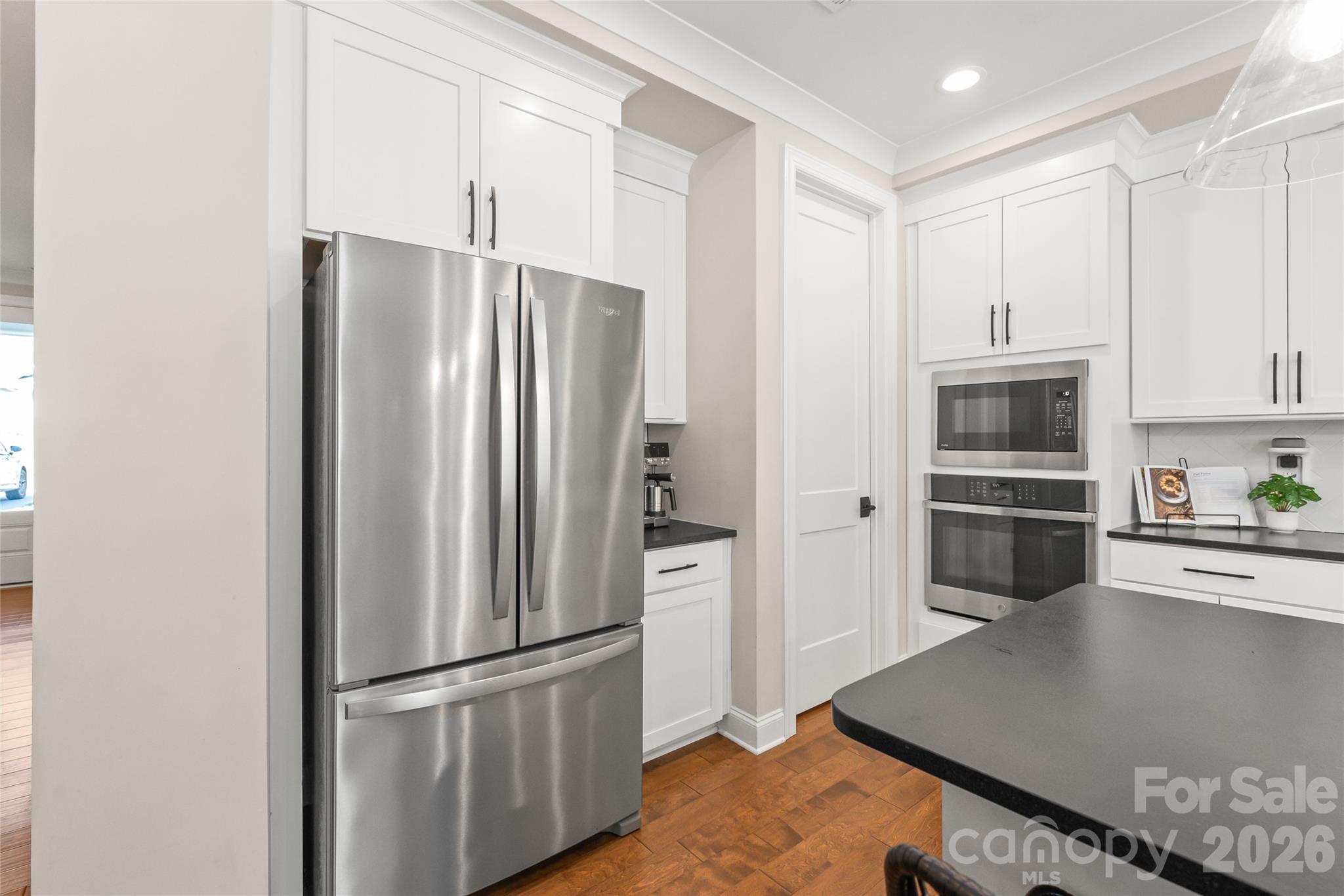 3213 Timber Run Lane Maiden, NC 28650 - Photo 17 of 47 a kitchen with stainless steel appliances granite countertop a refrigerator and a stove top oven