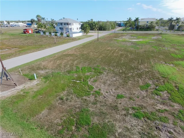 a view of a field with an ocean