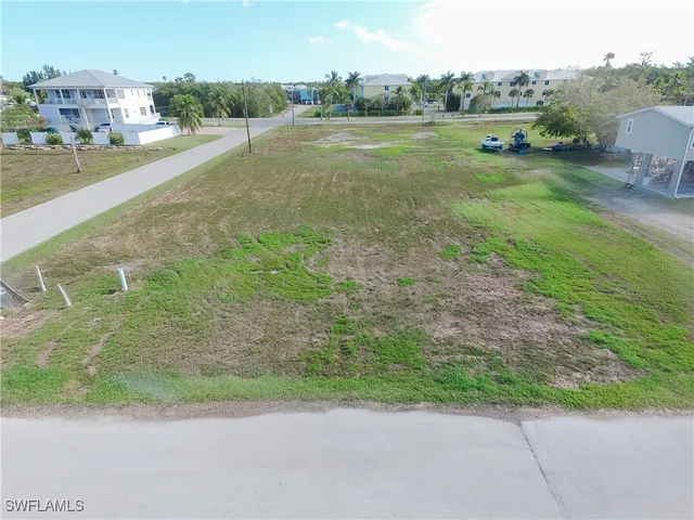 a view of a field with an ocean view