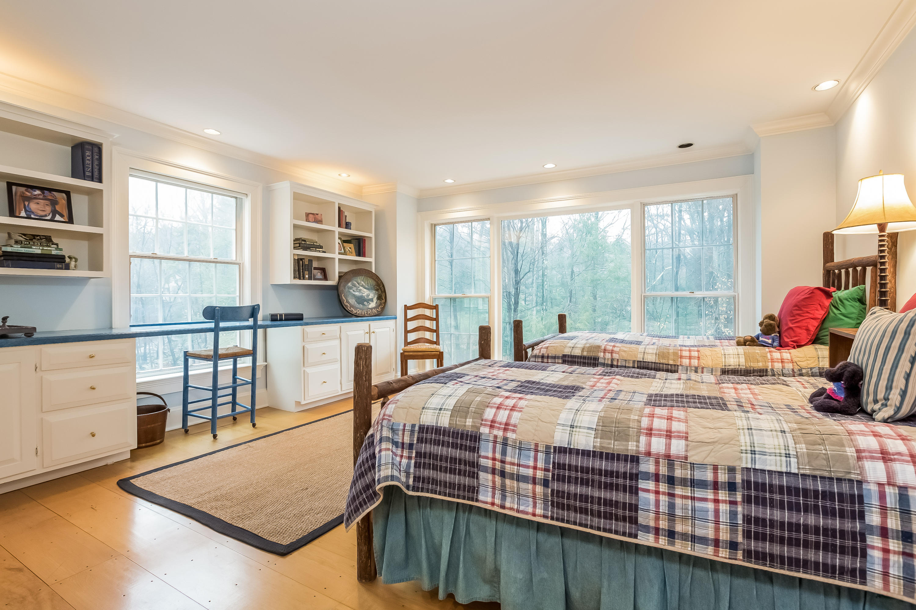 269 Valley Road New Canaan, CT 06840 - Photo 17 of 21 a bed sitting in a bedroom next to a window